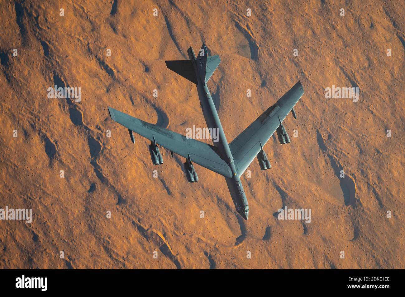 A U.S. Air Force B-52 Stratofortress strategic bomber aircraft from the 2nd Bomb Wing, departs after being refueled inflight from a KC-135 Stratotanker aircraft during a multi-day Bomber Task Force mission December 10, 2020 over Qatar. The bomber was relocated to the region following an increase in tensions with Iran. Stock Photo