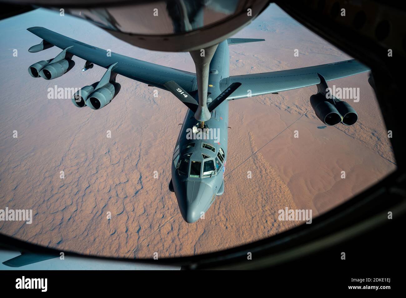 A U.S. Air Force B-52 Stratofortress strategic bomber aircraft from the 2nd Bomb Wing, is refueled inflight from a KC-135 Stratotanker aircraft during a multi-day Bomber Task Force mission December 10, 2020 over Qatar. The bomber was relocated to the region following an increase in tensions with Iran. Stock Photo