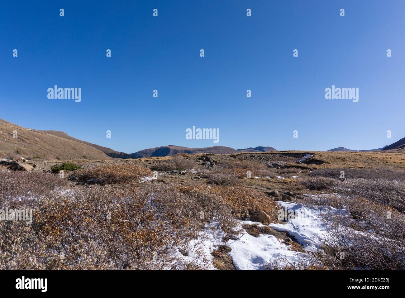 Hiking to Silver dollar Lake in Guanella pass Colorado early winter snow dusting Stock Photo