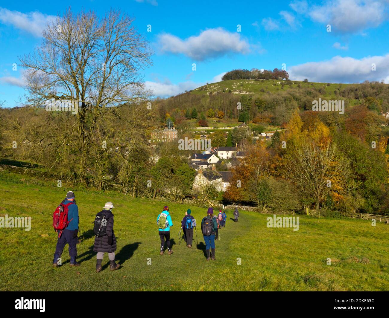 Group of walkers in autumn countryside near Parwich village in the Peak