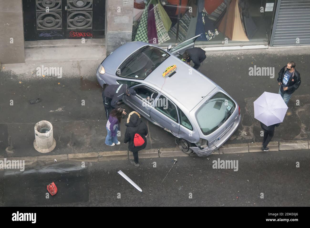 Taxi vehicle damaged due to non careful driving on wet asphalt Stock Photo