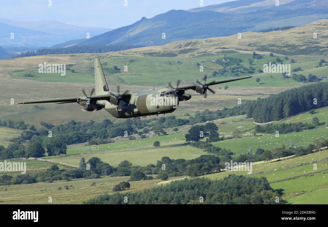 RAF Hercules ZH869, flying low over the countryside of Wales, in the 'mach loop' area. Stock Photo