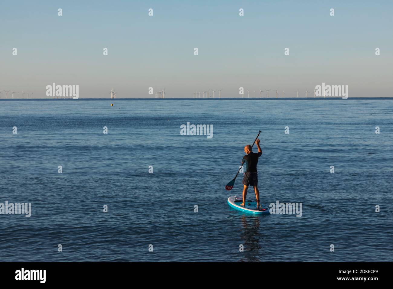 England, West Sussex, Worthing, Worthing Beach, Paddle Boarder on Calm Sea Stock Photo