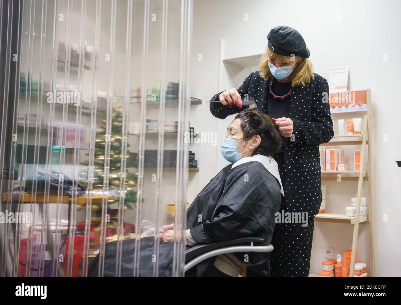 15 December 2020, Hessen, Frankfurt/Main: Svetlana Basato from the hair  salon 