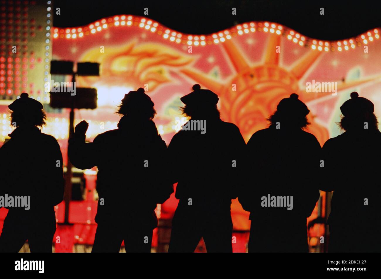 Five men dressed in Scottish 'Jimmy Wig' hats enjoying Edinburgh