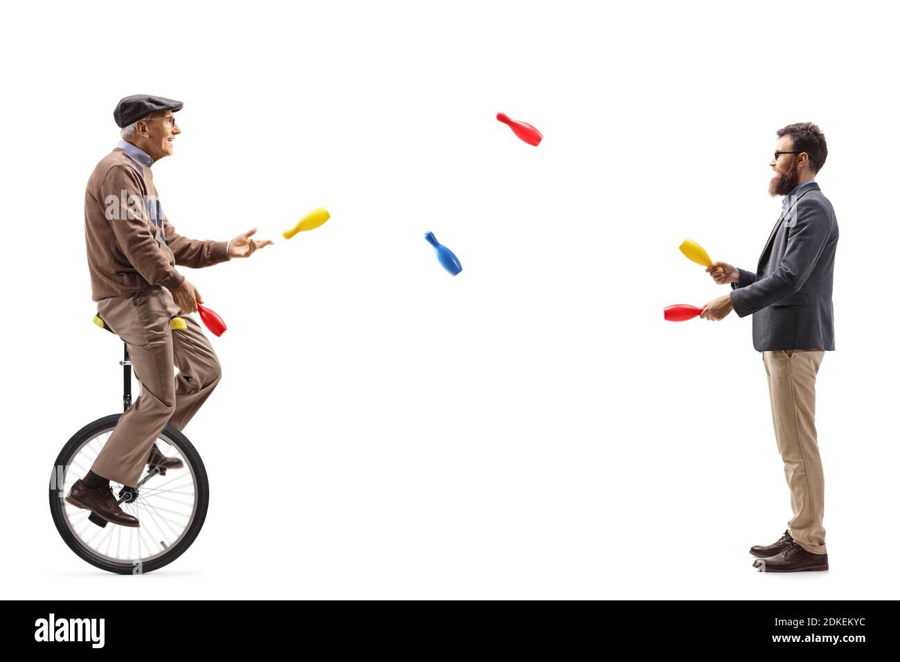 Younger and elderly manon a unicycle juggling isolated on white ...