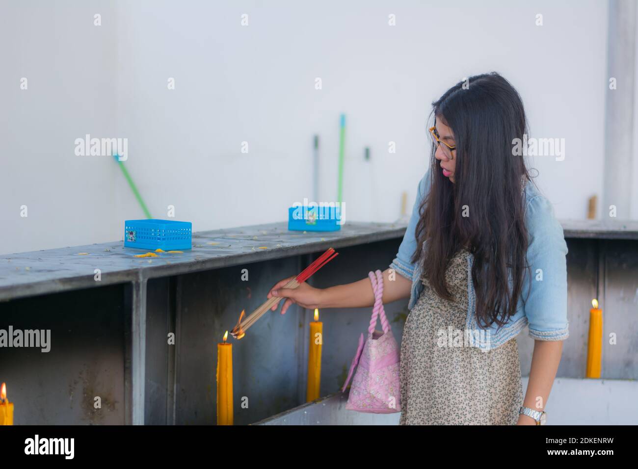 Young woman holding incense sticks hi-res stock photography and images ...