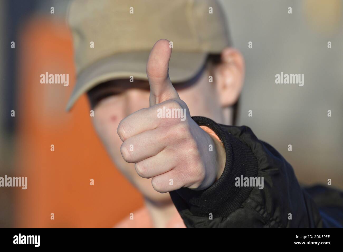 Close-up Of Man Gesturing Thumbs Up Stock Photo