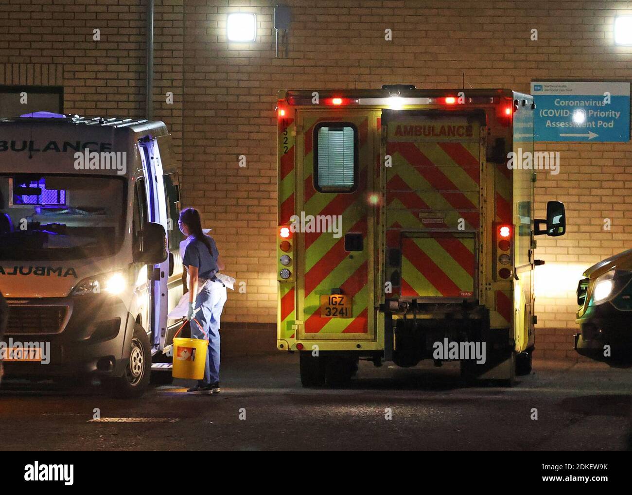 Medical staff attending to patients in an ambulance, at Antrim Area