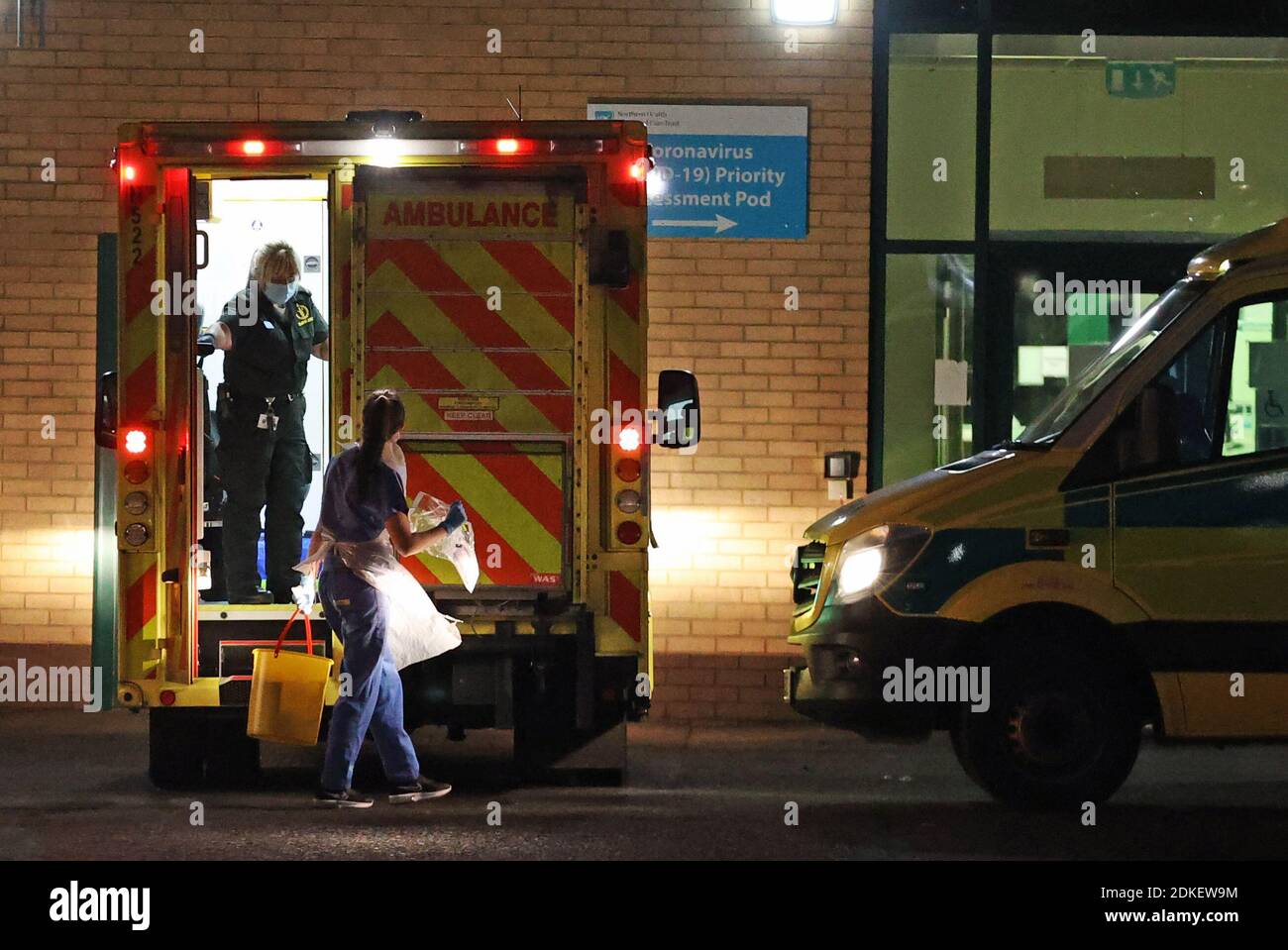 Medical staff attending to patients in an ambulance, at Antrim Area