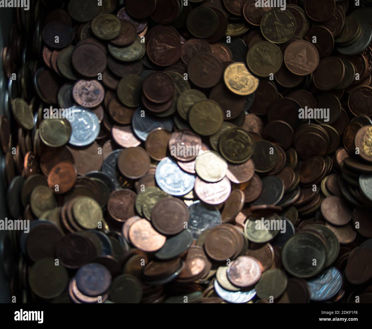 blur image many coins in the box Stock Photo Alamy