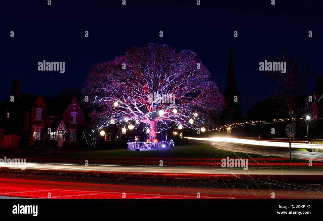 Astbury, Cheshire, UK. 15th December 2020. Car headlights form light
