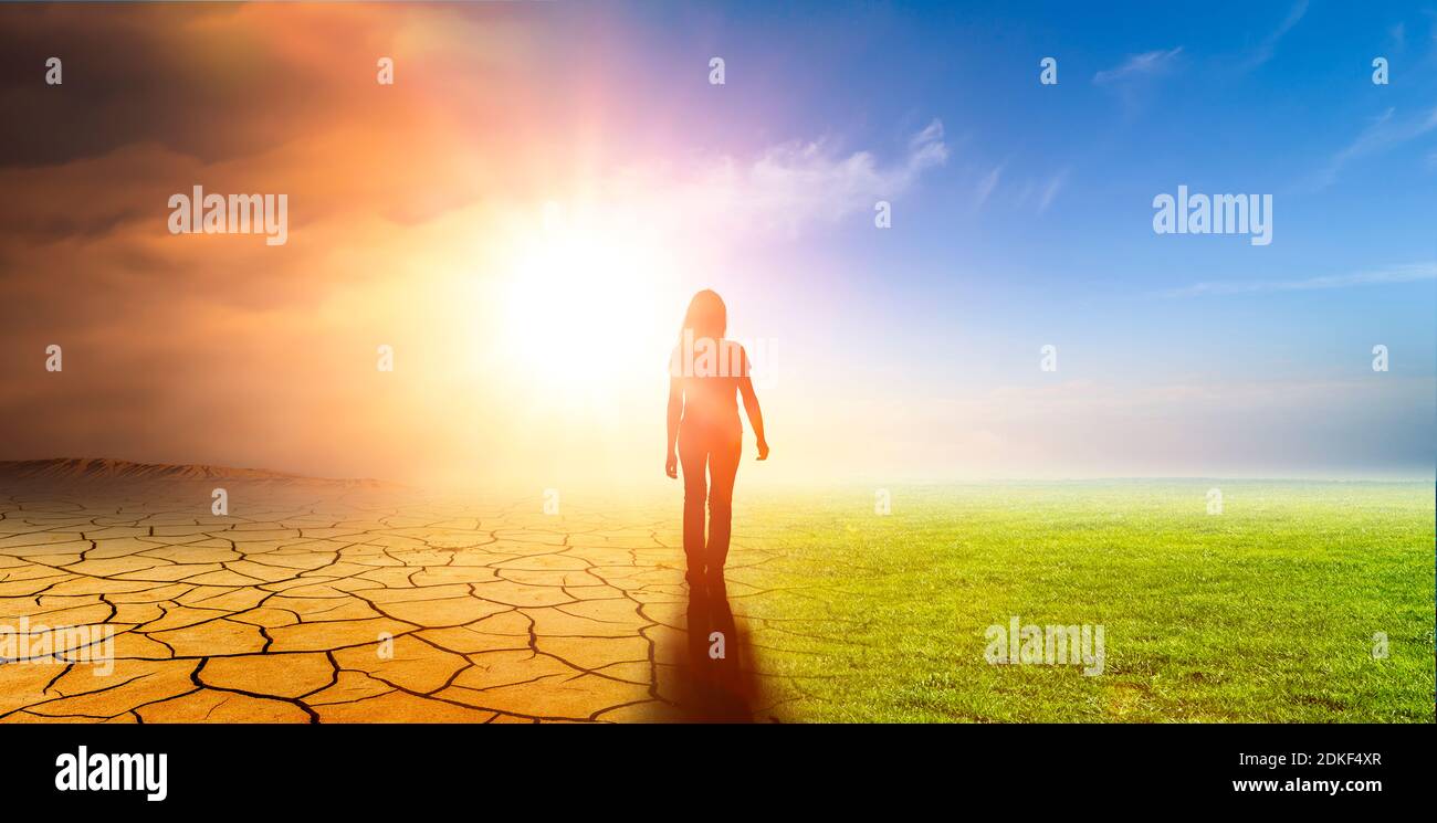 Woman in a landscape with climate change Stock Photo