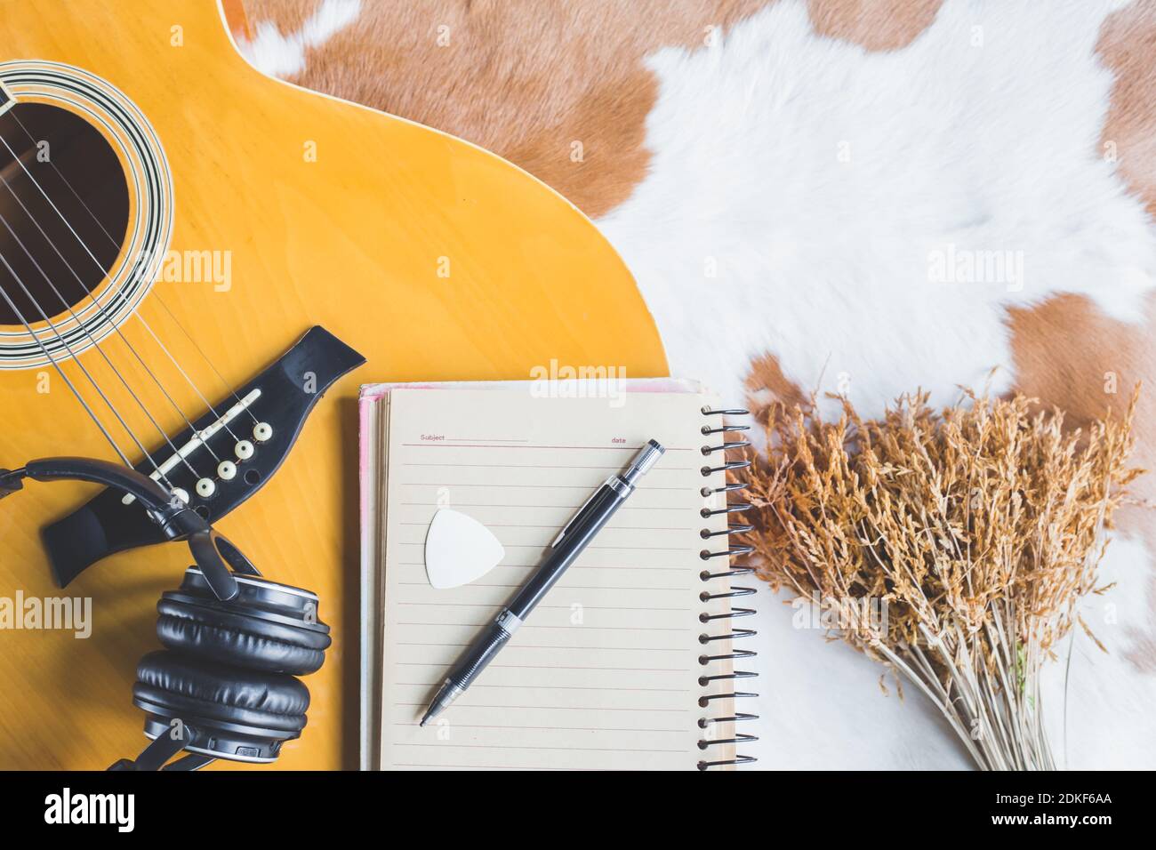 Top view of acoustic guitar with paper and pen for composing with headphone  and space for wording Stock Photo - Alamy