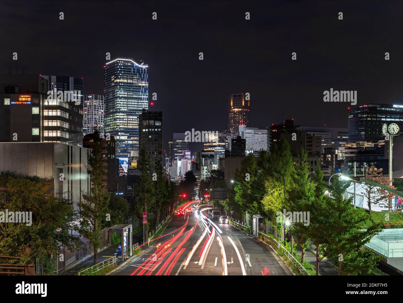 tokyo, japan - november 02 2019: Night view with traffic cars headlights on the Fire Street leading from Harajuku to Shibuya with the new skyscrapers Stock Photo
