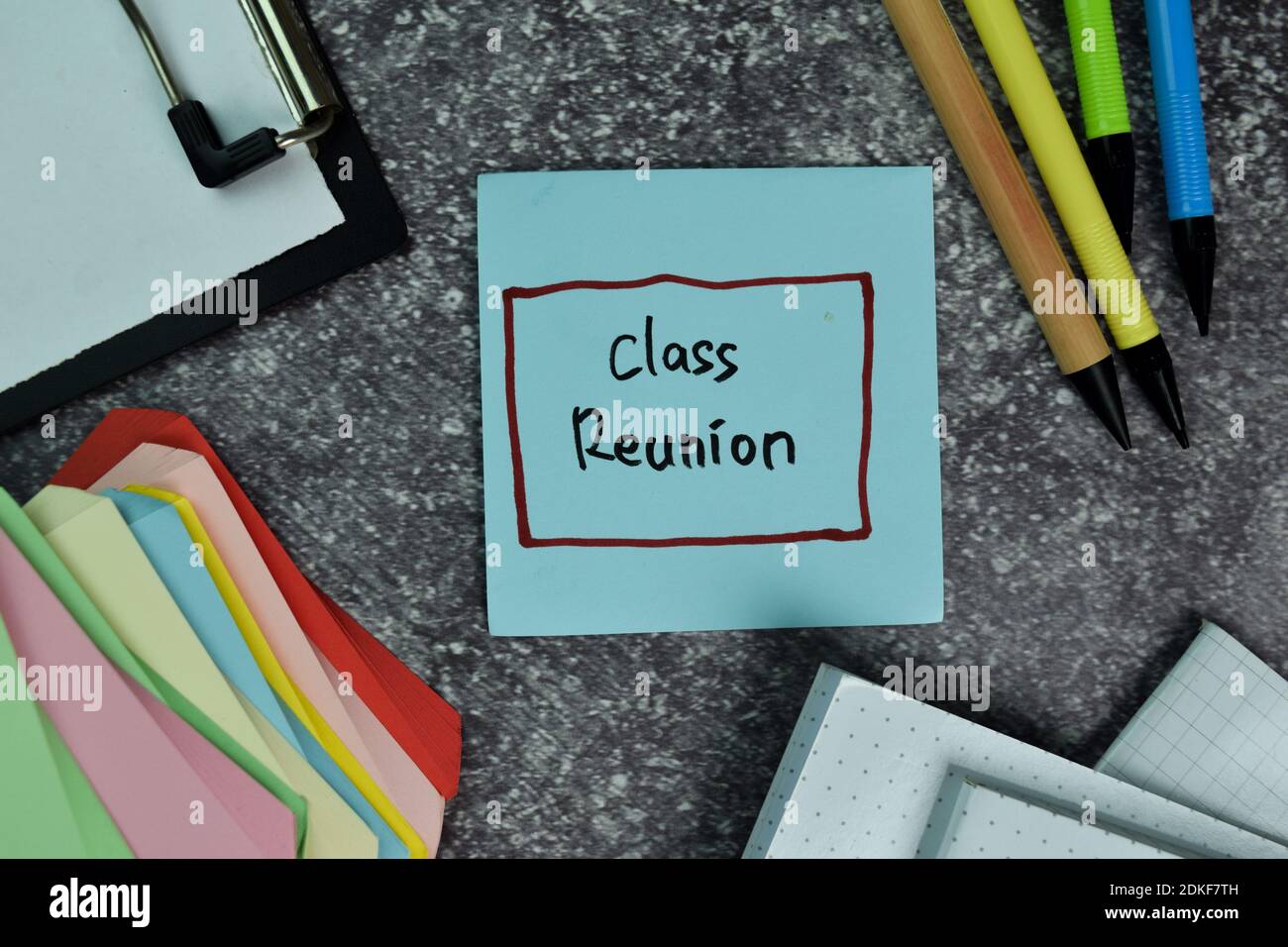 Class Reunion write on sticky notes on the table. Education concept Stock Photo