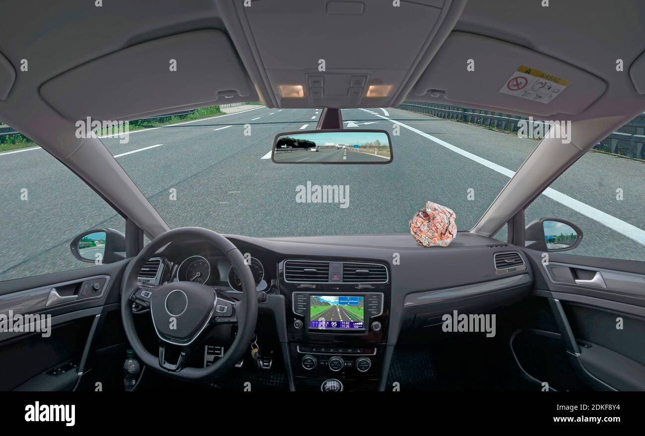 Settlers hardware instructor Car interior view with navigation system and a crumpled road map on the  shelf Stock Photo - Alamy