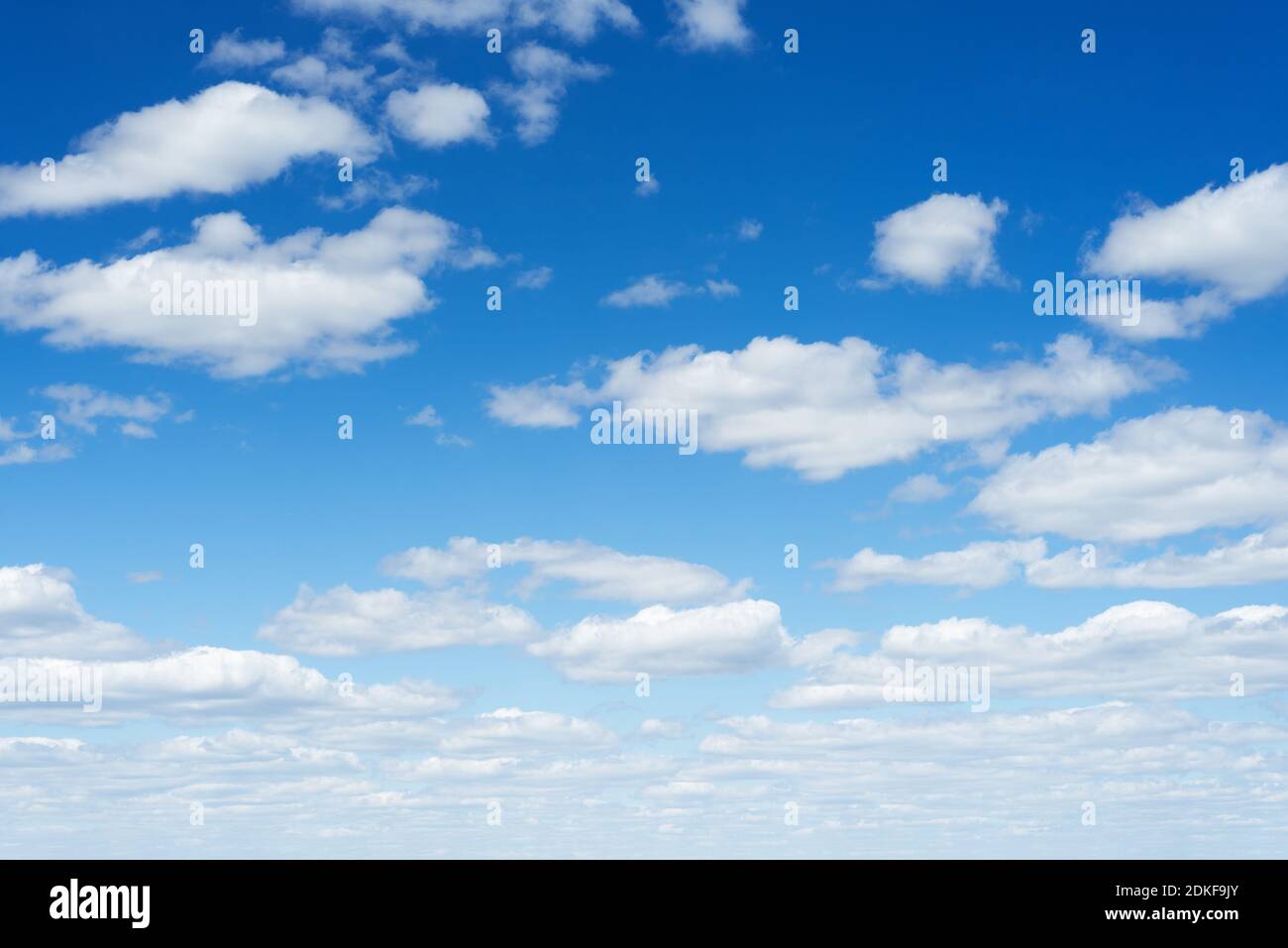 Blue sky with white cumulus clouds Stock Photo - Alamy