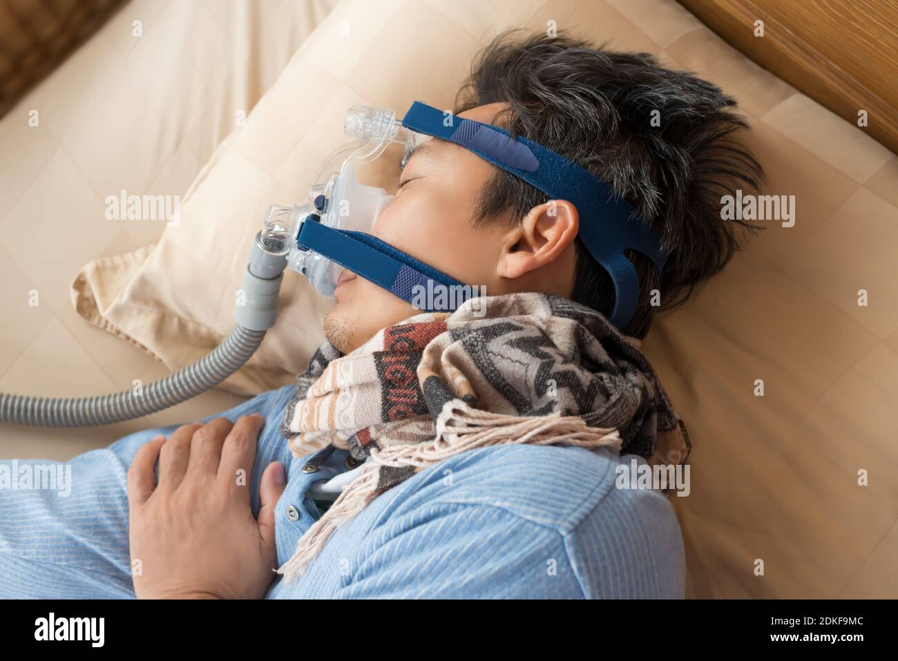 Middle aged man with obstructive sleep apnea sleeping well with cpap