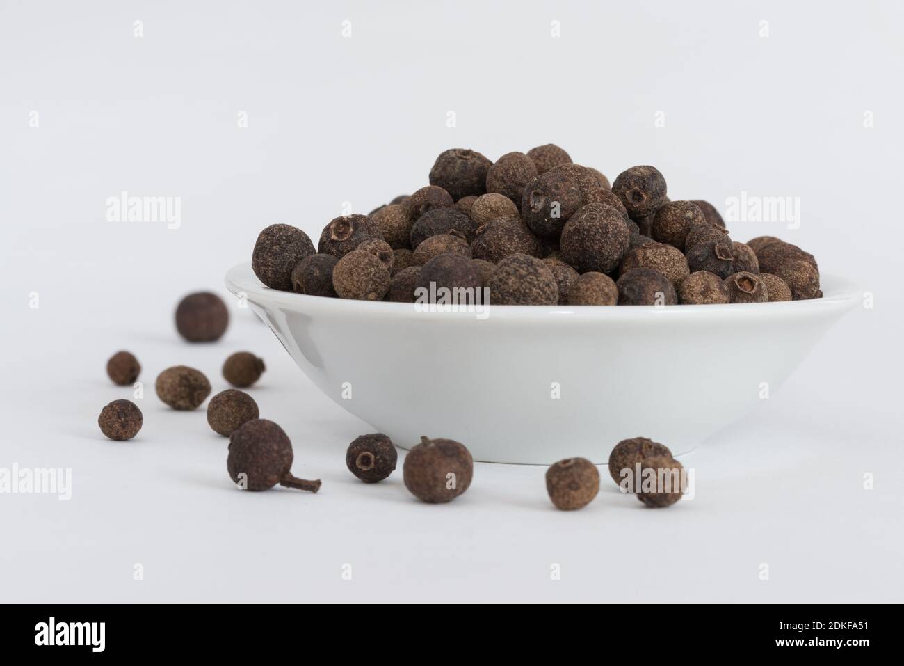 Seeds In Bowl Against White Background Stock Photo