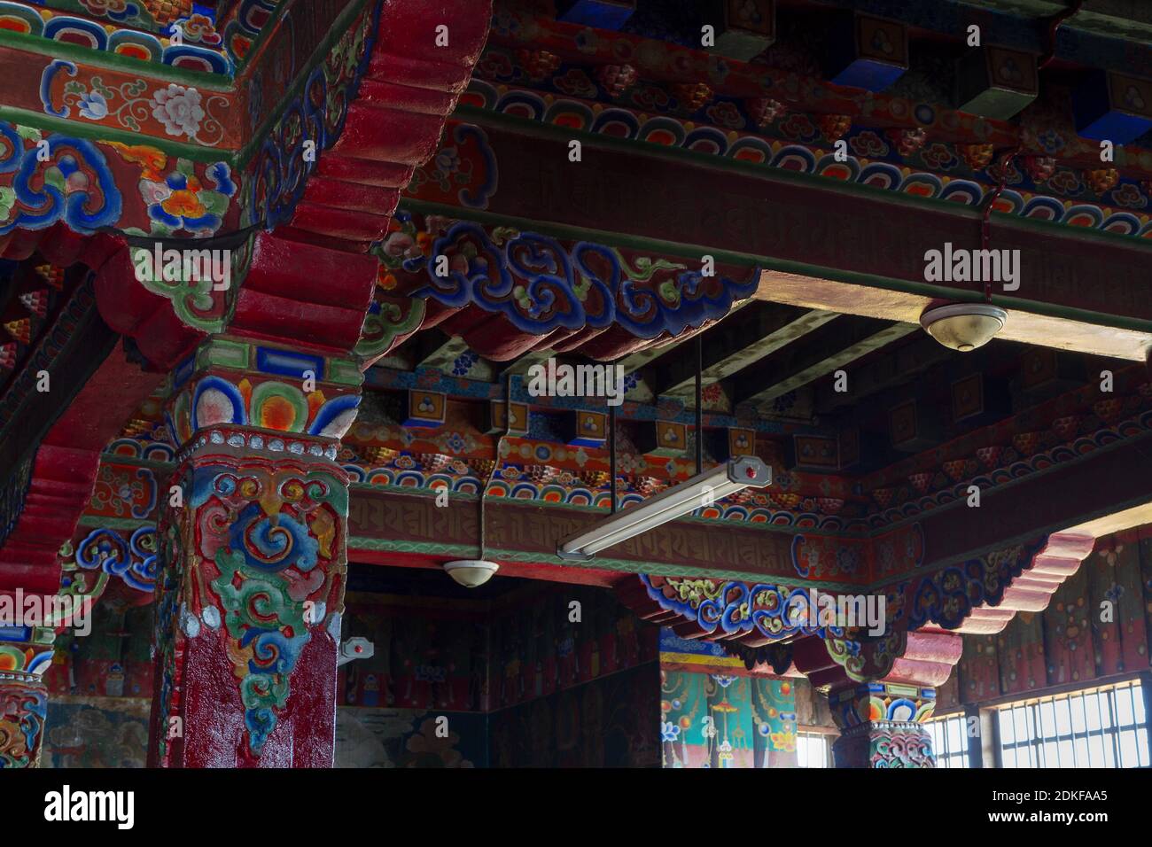 Pemayangtse, Sikkim, India - 31 Dec, 2011: colorfully painted ceiling and carved columns, ornaments in the buddhist temple Stock Photo