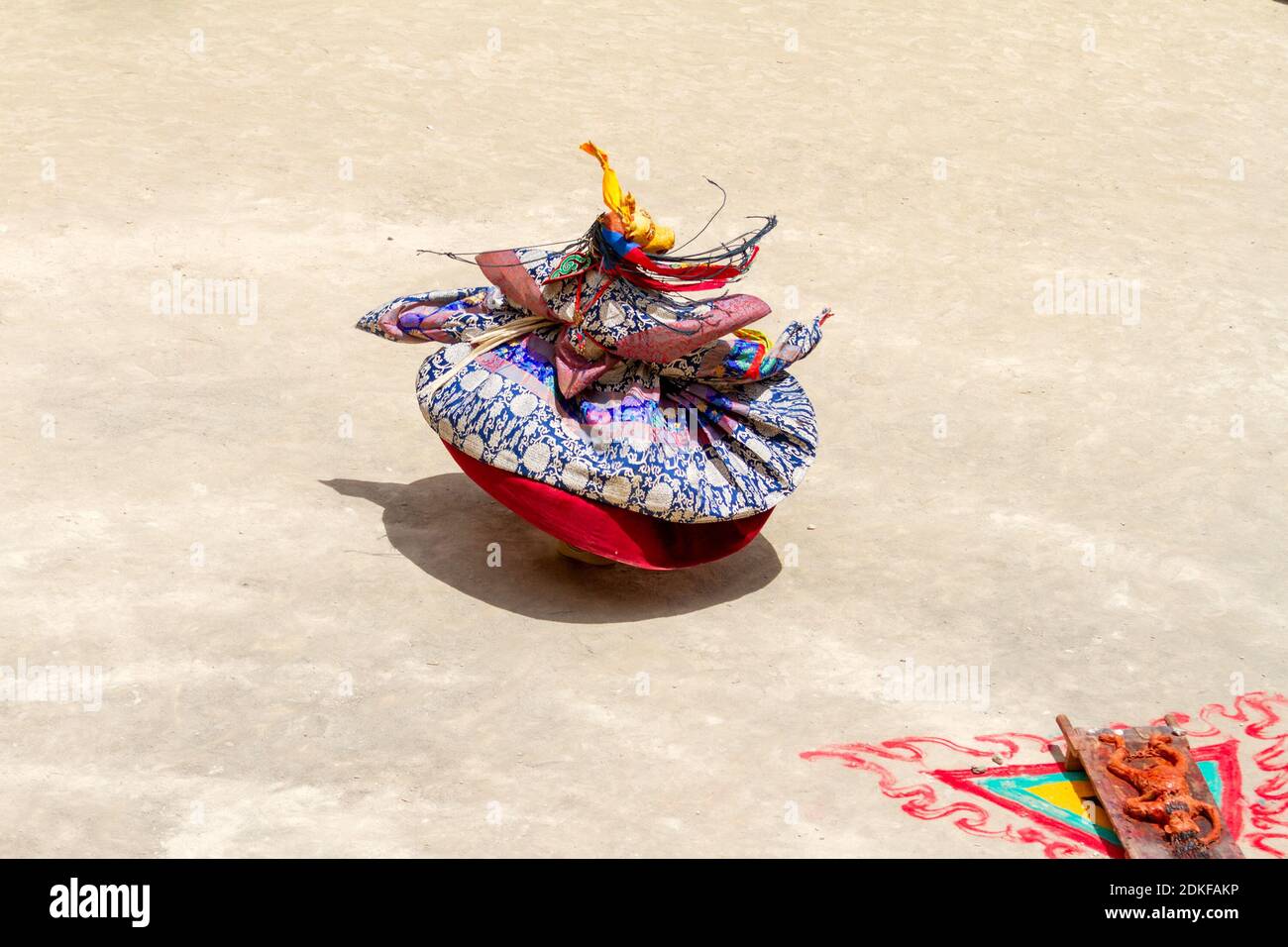 Unidentified monk in deer mask performs a religious masked and costumed mystery Cham dance of Tibetan Buddhism around the symbolic sacrifice at the Yu Stock Photo