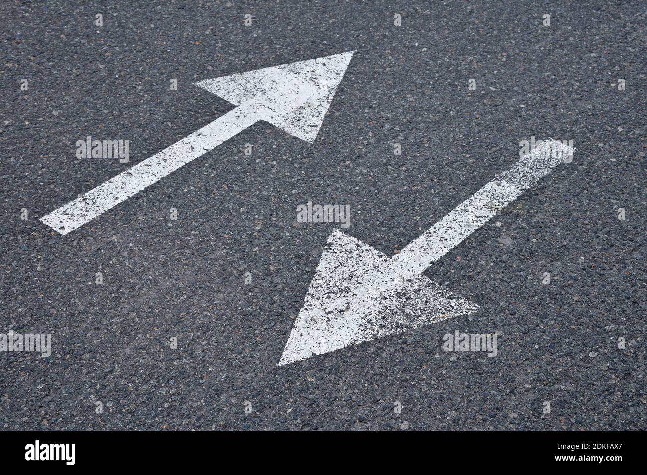 High Angle View Of Arrow Symbols On Road Stock Photo