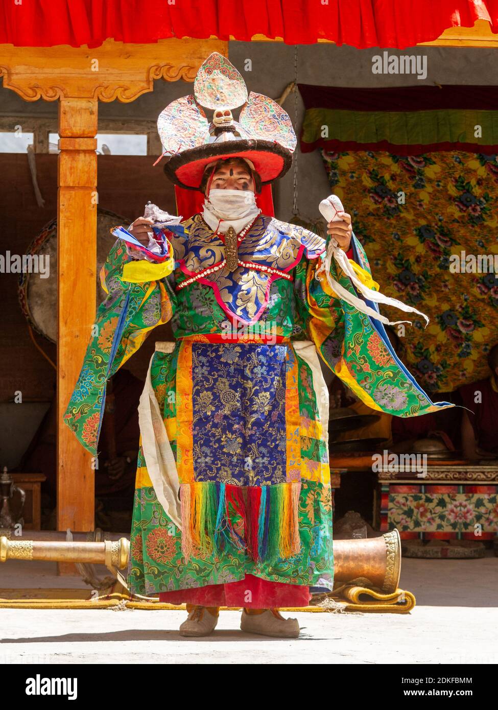 Padum, Zanskar, India - July 17, 2012: Lama in ritual costume and ornate hat performs a historical mystery Black Hat Dance of Tibetan Buddhism on the Stock Photo
