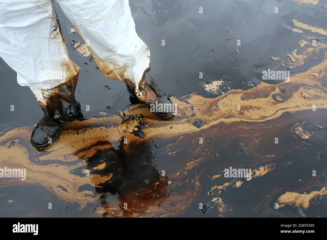 clean up Crude oil stain at Ao Prao Beach in , Rayong, Thailand Stock