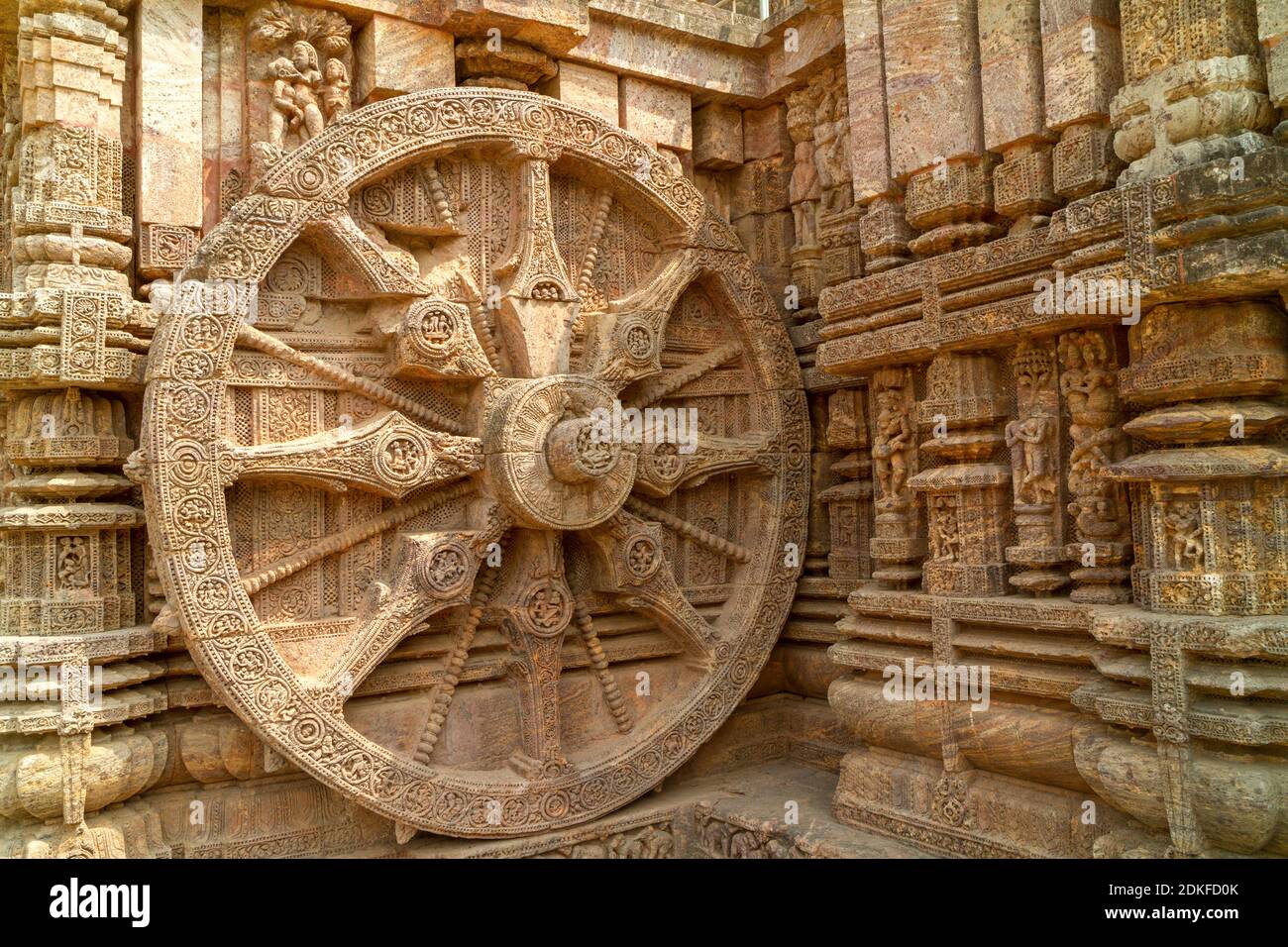 Close-up of chariot wheel intricate carvings in the ancient Hindu Sun Temple in Konark, Orissa, India. 13th-century CE. The temple is attributed to ki Stock Photo