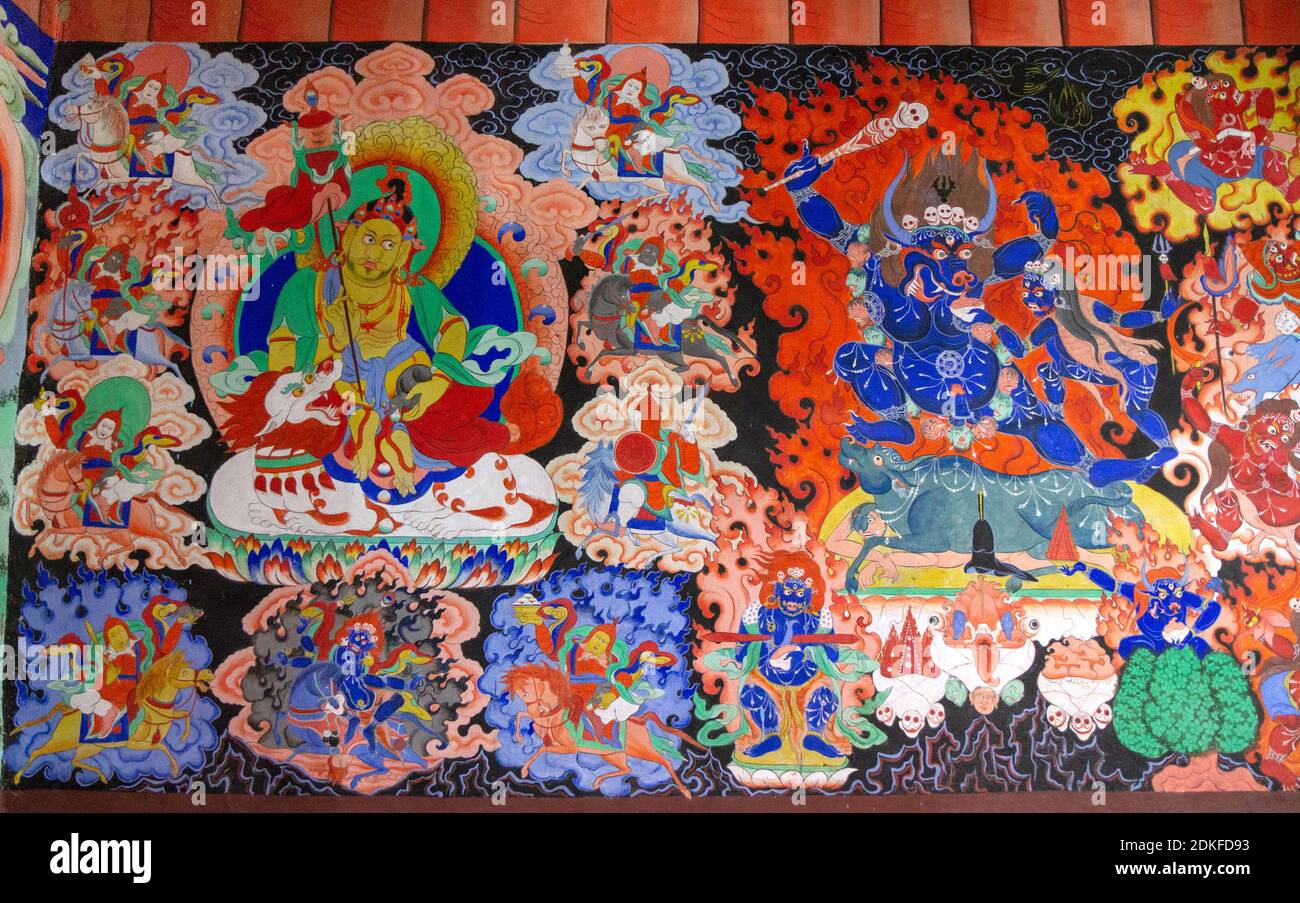 Samstanling, India - June 23, 2012: Dharmapala wrathful deity colorful wall painting, spiritual and ritual symbol of Buddhism, in Samstanling monaster Stock Photo