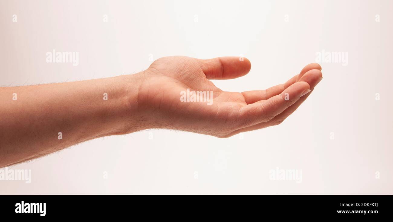 Open man's hand against a light background Stock Photo