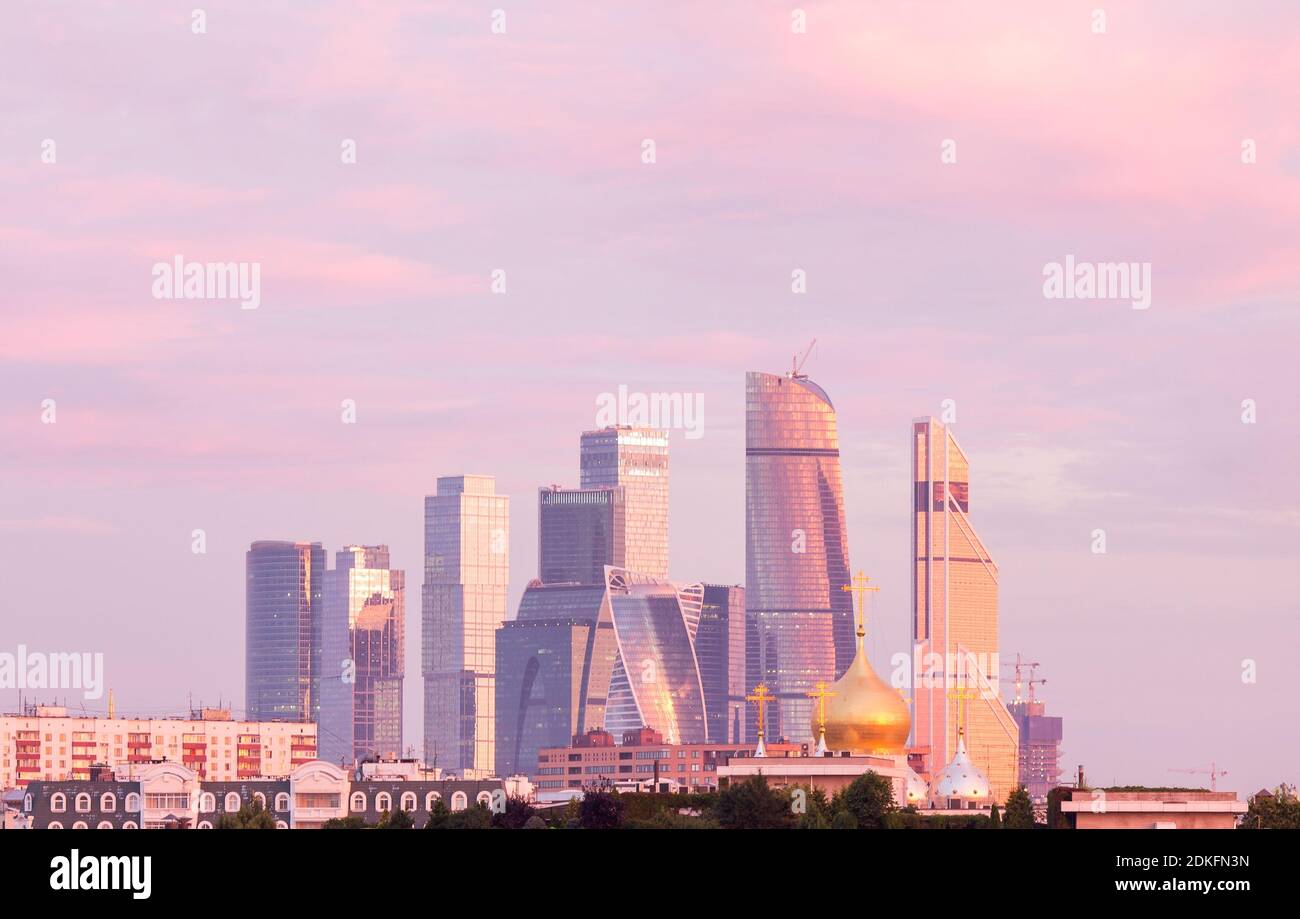 Panorama of Moscow International Business Center on the background of colorful gradient of the sky at the cloudless sunrise early in the morning. View Stock Photo