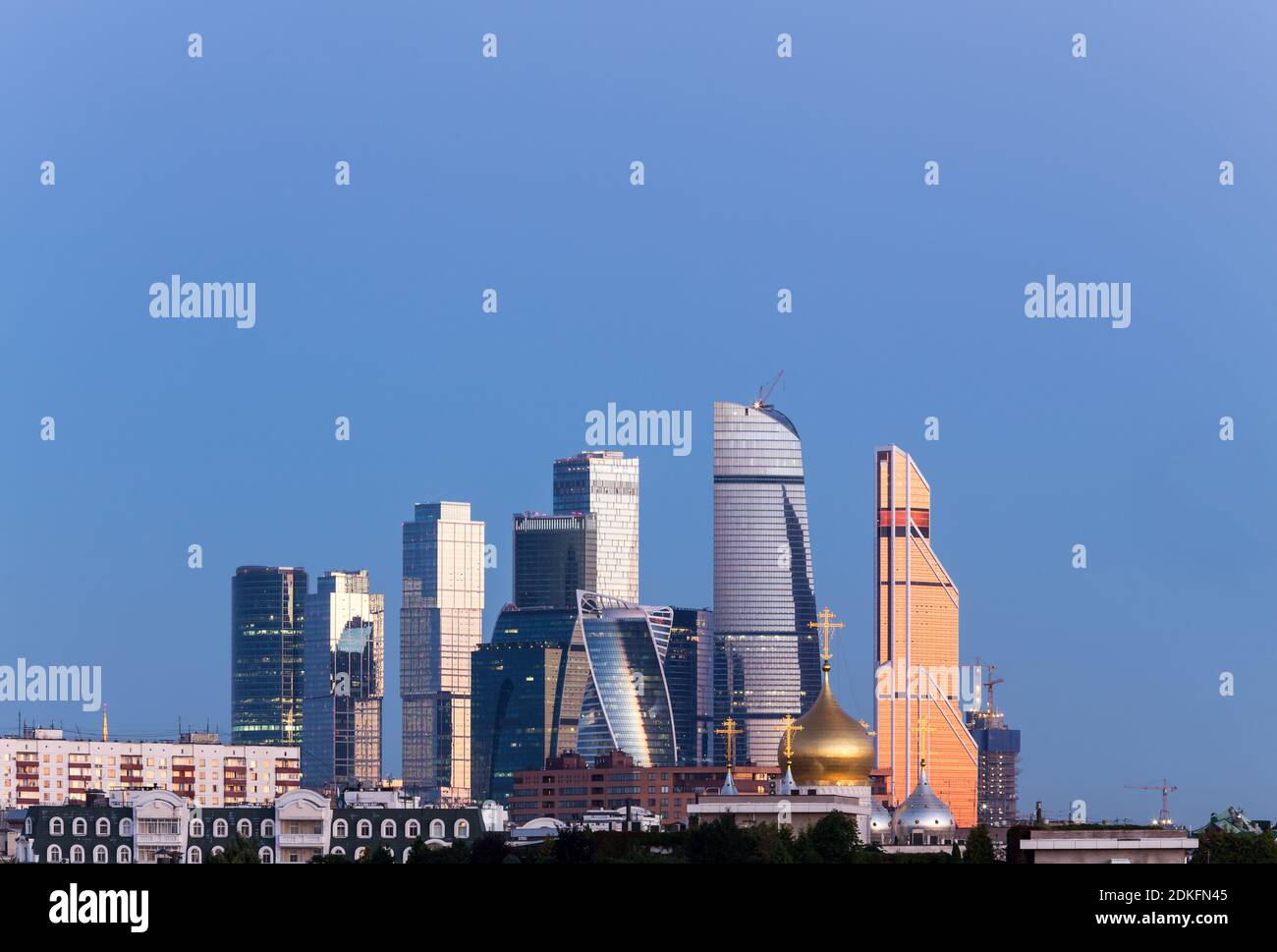 Panorama of Moscow International Business Center on the background of colorful gradient of the sky at the cloudless sunrise early in the morning. View Stock Photo
