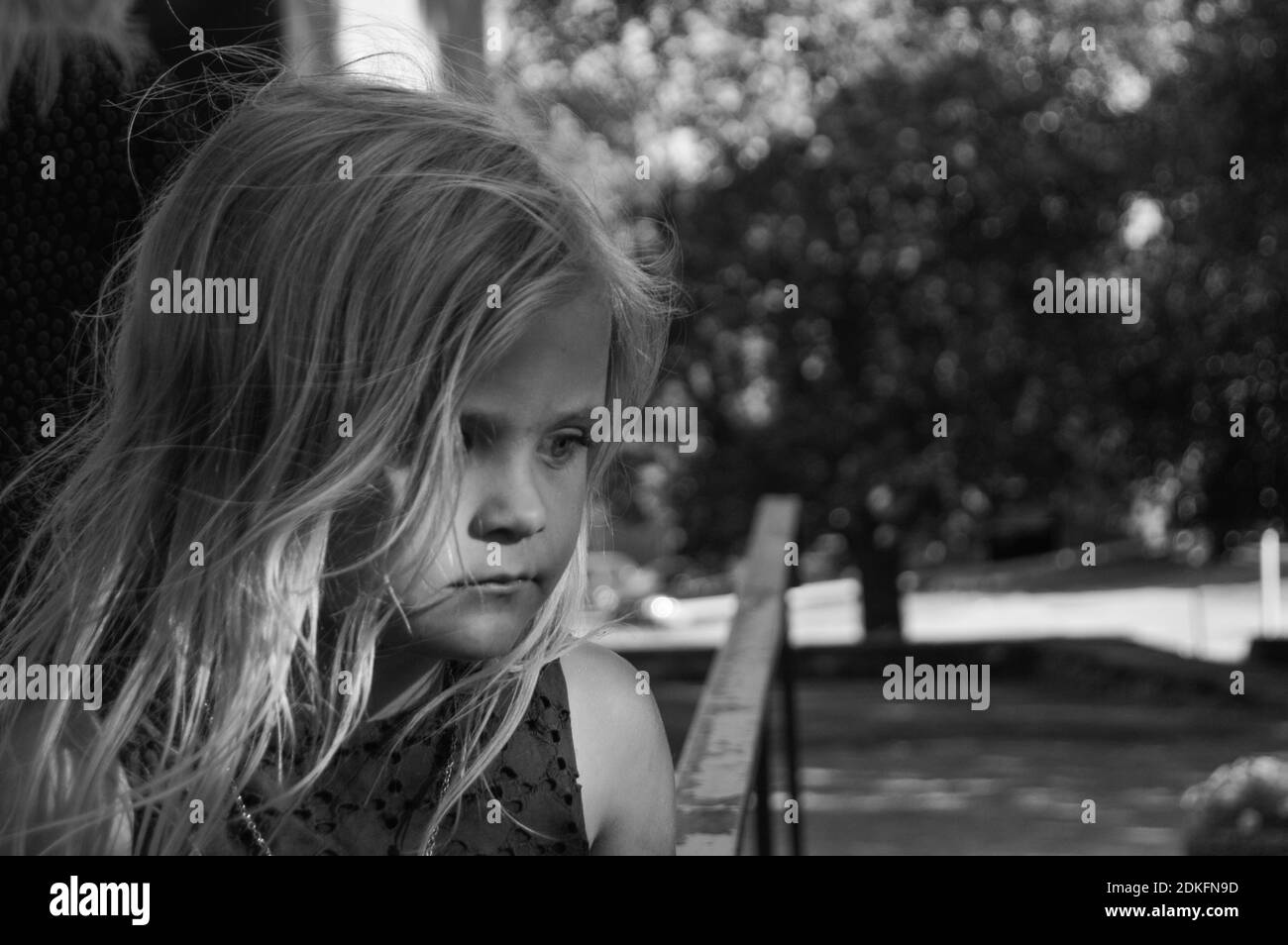 Portrait Of Girl Looking Down Stock Photo