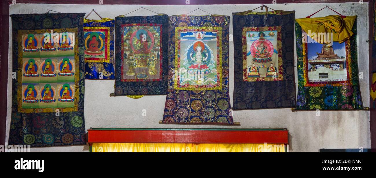 Rumtek, India - November 18, 2011: Buddhist thangkas - a Tibetan Buddhist paintings on cotton, or silk appliques - in a Rumtek monastery, Sikkim, Indi Stock Photo