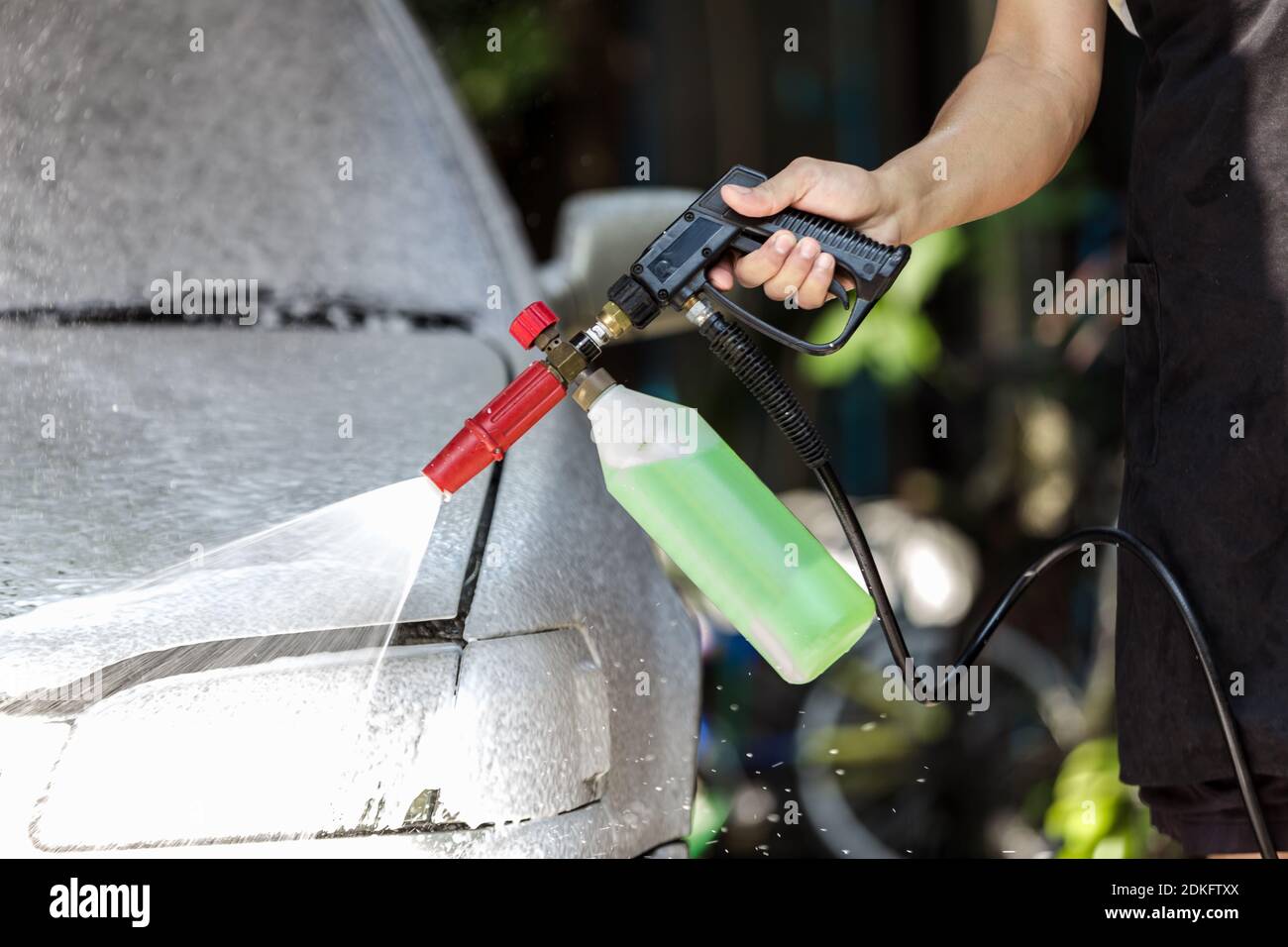 Car washing cleaning,Cleaning car using high pressure  spray foam Stock Photo