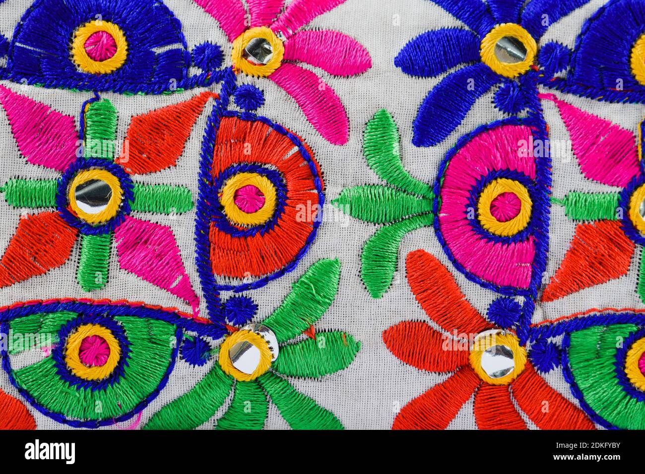 Colorful Kutchi embroidery on cloth woven weaving dont by artisans. Handmade thread works, mirror work from Gujarat, India Stock Photo