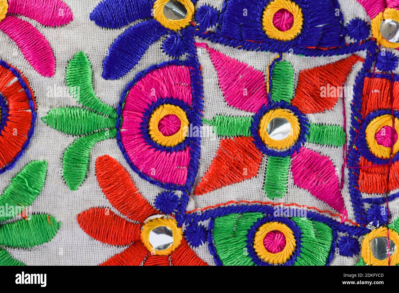 Colorful Kutchi embroidery on cloth woven weaving dont by artisans. Handmade thread works, mirror work from Gujarat, India Stock Photo