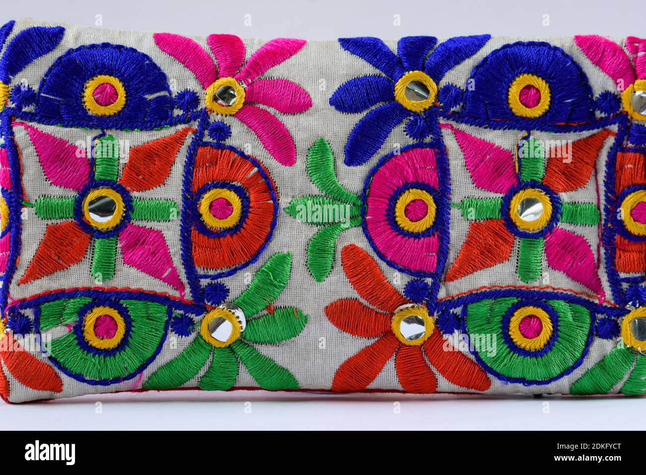 Colorful Kutchi embroidery on cloth woven weaving dont by artisans. Handmade thread works, mirror work from Gujarat, India Stock Photo