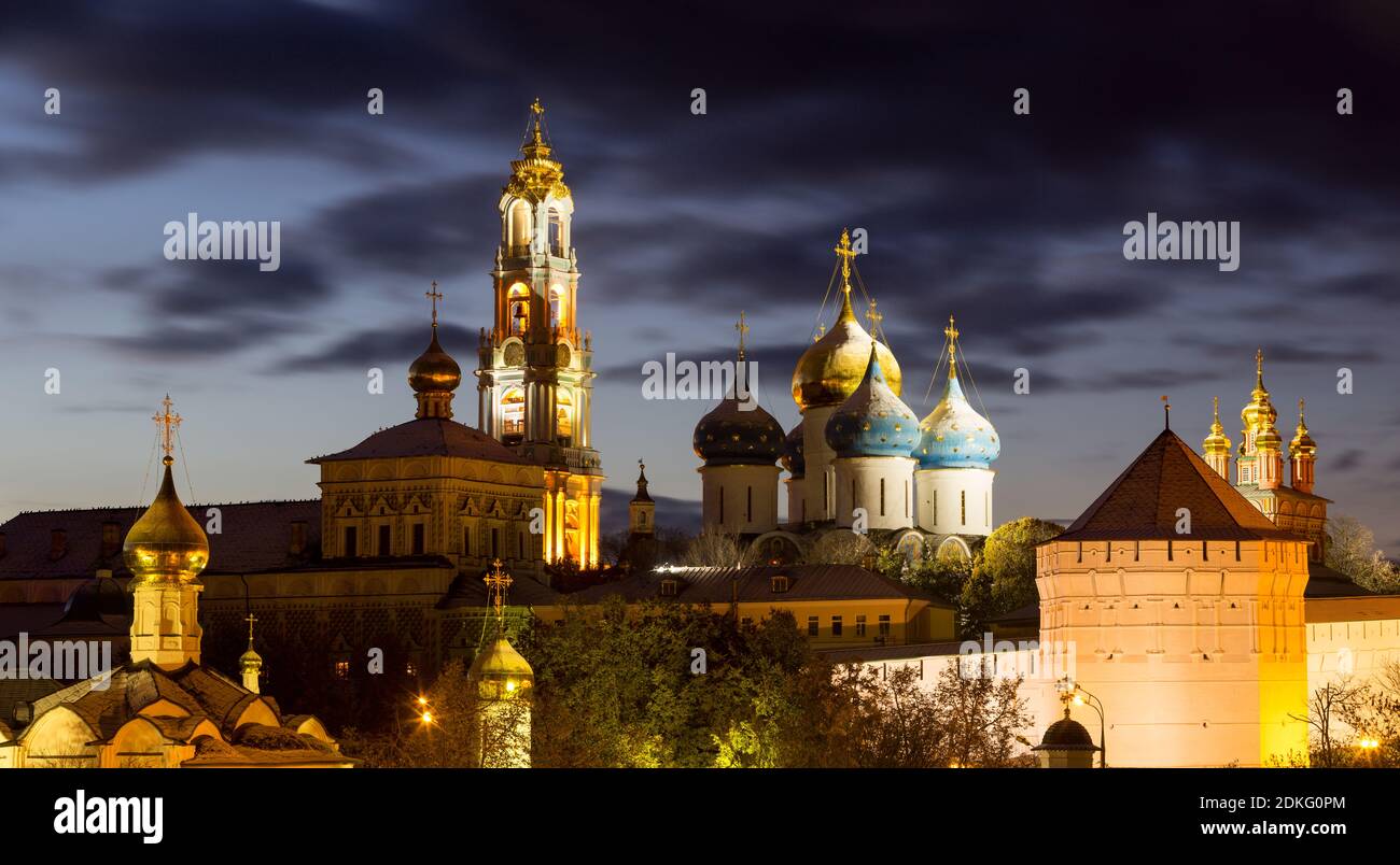 Panorama of the Trinity Lavra of St. Sergius after sunset with a spectacular backlight (Sergiyev Posad, Russia) Stock Photo