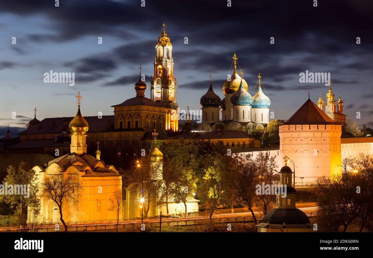 Panorama of the Trinity Lavra of St. Sergius after sunset with a spectacular backlight (Sergiyev Posad, Russia) Stock Photo