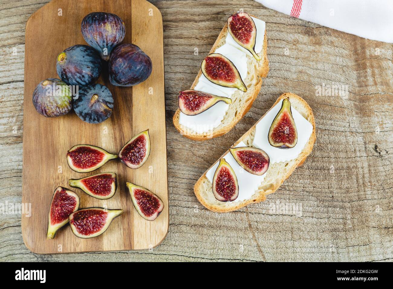 Figs with fresh cheese on toast Copy space. Stock Photo