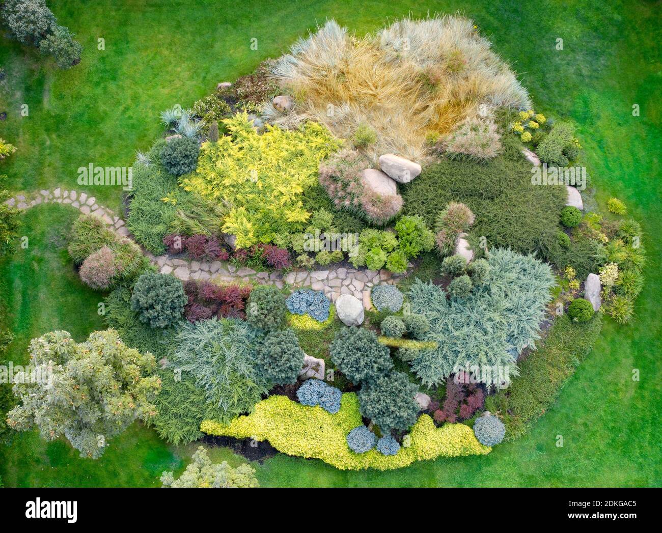 Large flower bed with various ornamental plants, top view Stock Photo