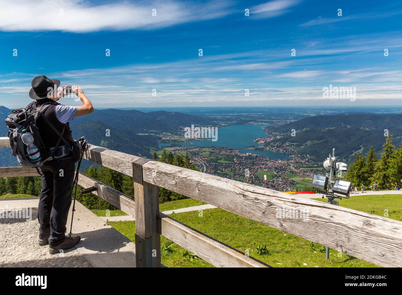 Man taking photos with the smartphone in the direction of Tegernsee, Wallberg, Rottach-Egern, Tegernsee, Bavarian Alps, Bavaria, Germany, Europe Stock Photo