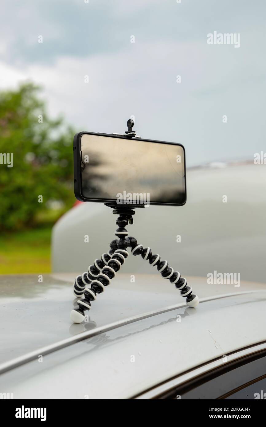 Articulating mini tripod for photography holding a smartphone Stock Photo