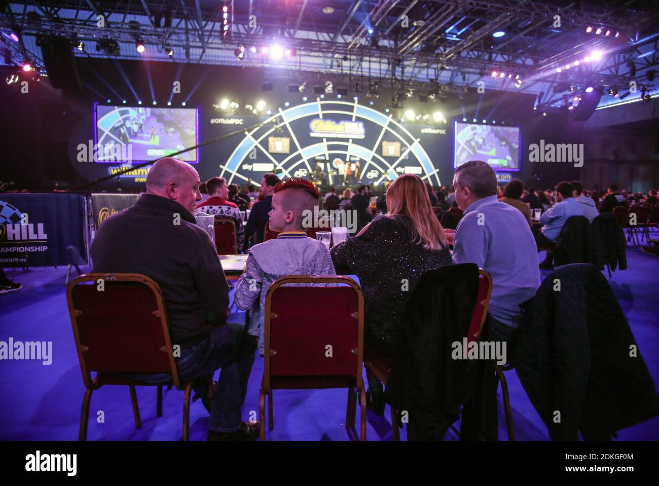 Fans watch the darts during day one of the William Hill World Darts  Championship at Alexandra Palace, London Stock Photo - Alamy