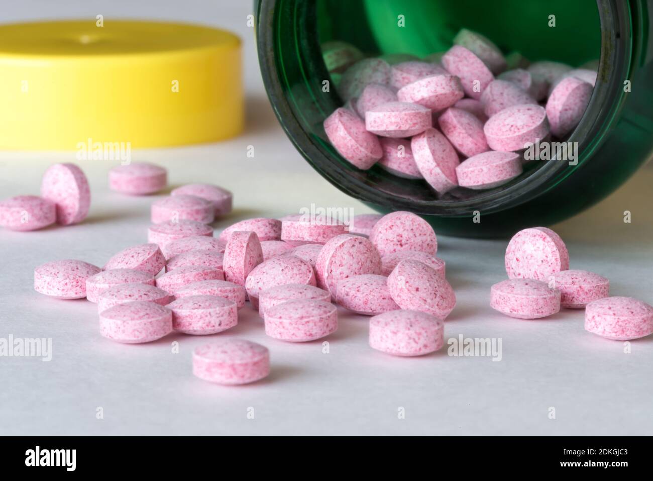 Close-up Of Pink Candies Spilling From Container Stock Photo