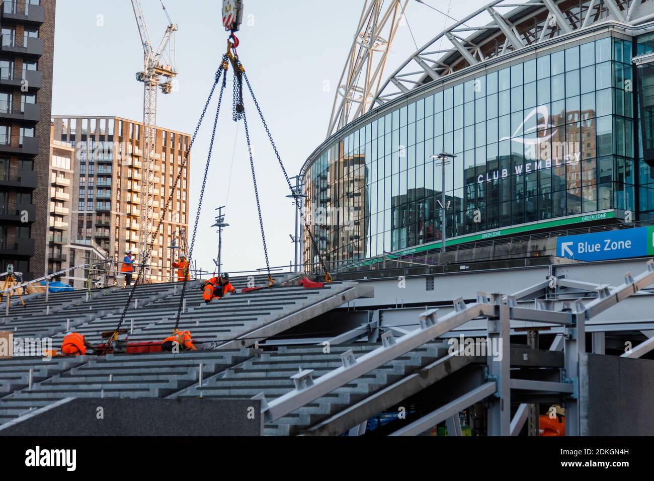 Wembley Stadium, Wembley Park, UK. 15th December 2020.Construction continues at Wembley Stadium where pre-cast concrete step modules are being lifted into place. The Olympic Steps, which will replace the recently demolished pedway, will take visitors from Olympic Way to the ticket office level and concourse.To read more about the project, please visit www.wembleypark.com/olympicsteps. Amanda Rose/Alamy Live News Stock Photo