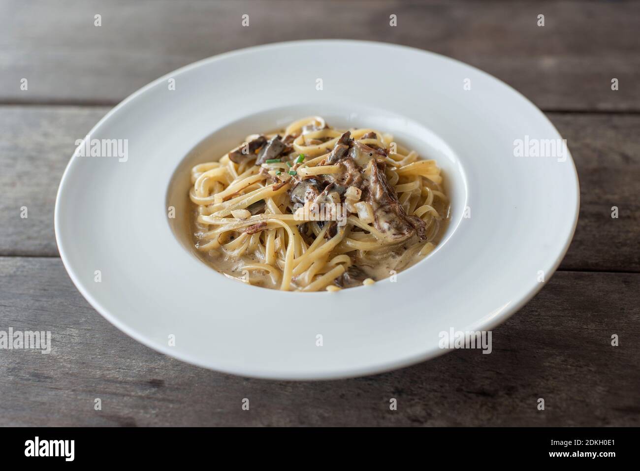 Close-up Of Noodles In Plate On Table Stock Photo